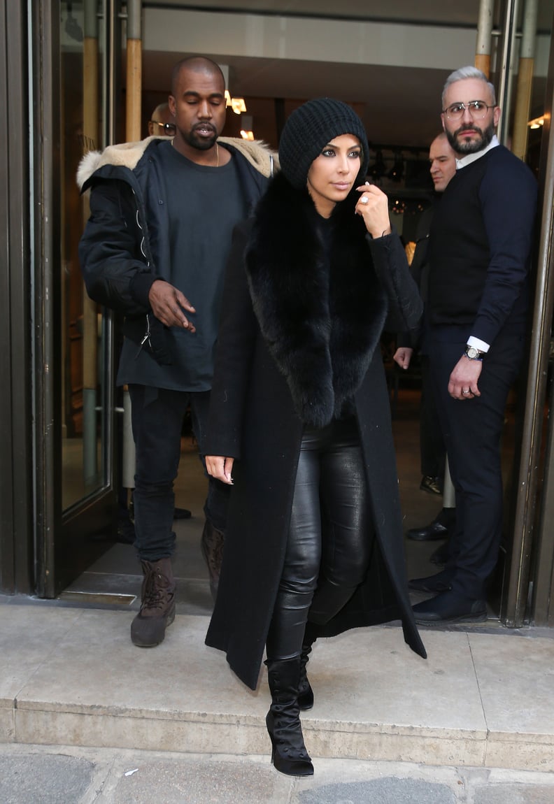 Kim Bundled Up For the Cold in a Fur-Collared Coat and Slouchy Black Beanie