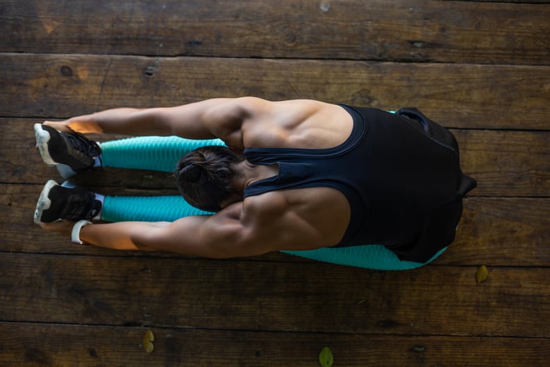 20 year old fitness girl stretching