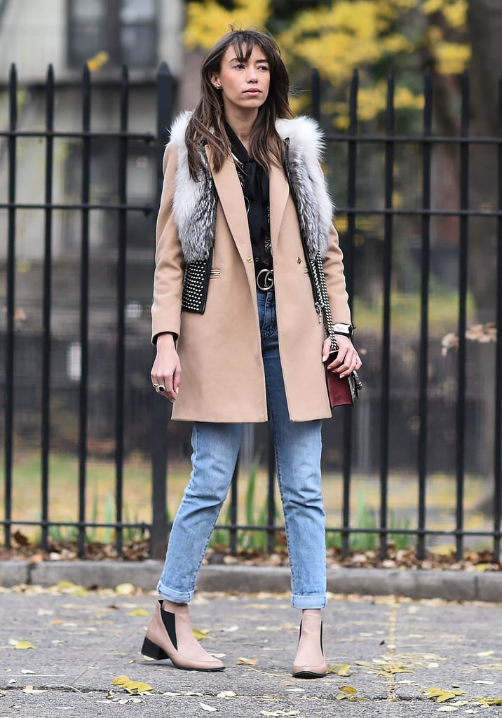 For a fun spin, wear your favorite vest over another coat. Thania Peck styled her cropped Thomas Wylde fur vest over a Topshop beige coat for that fashion girl touch.