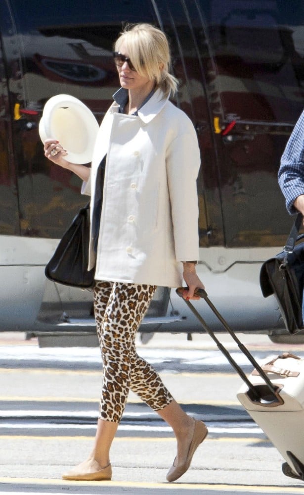 Chances are Cameron Diaz's leopard-print pants and sleek white coat are a lot cooler than your usual airplane look, but they're just as easy to throw together and just as comfy when you finish off the look with flats and a sharp tote like her Saint Laurent.