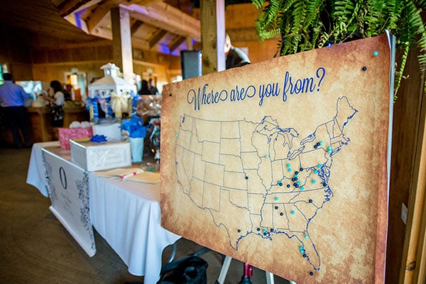 Have your relatives and friends sign in using a non-traditional "guest book," like this pinboard map highlighting where guests call home.
