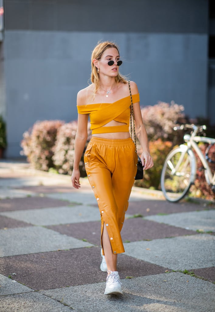 We're all about this matchy-matchy look. Wearing a crop top and high-waist pants in the same colour gives the illusion of a jumpsuit — with just a (surprise!) flash of skin.