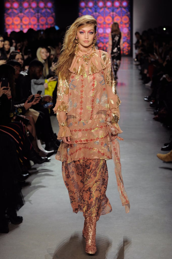 She switched into a high-neck floral dress on the runway for her second look.