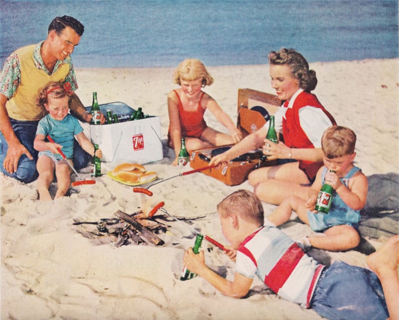 Just an all-American family enjoying dogs on the beach.