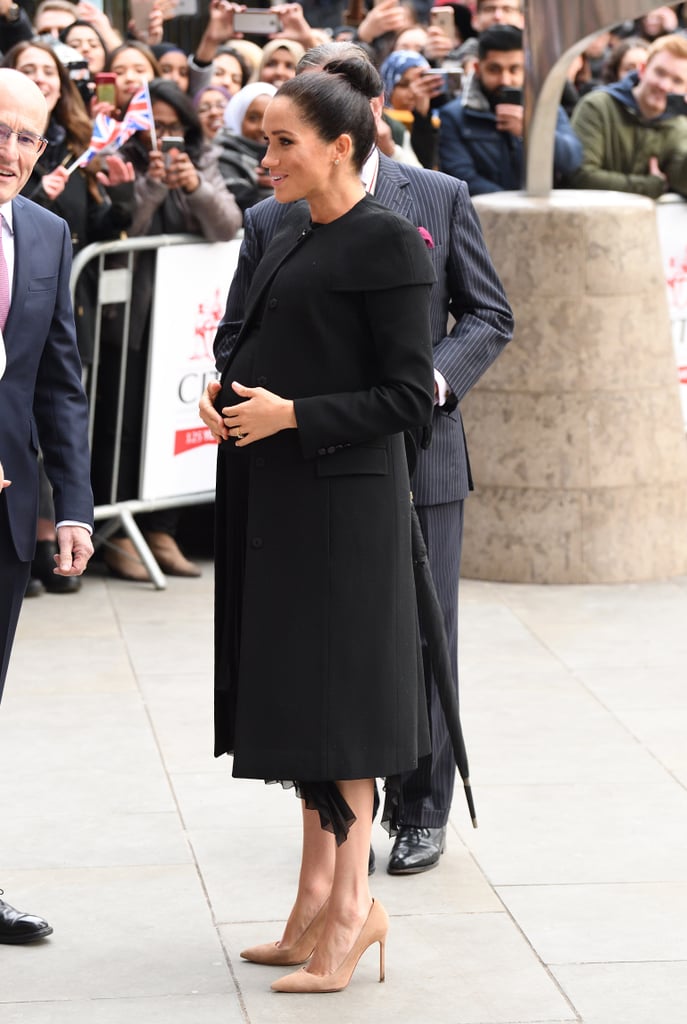 Meghan wore a black Givenchy coat.