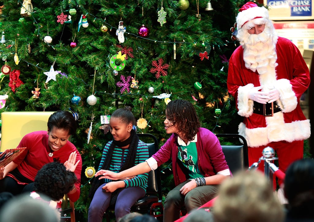 Apparently dogs get just as scared of Santa as little kids do. While reading Christmas stories at the Children's National Medical Center in 2009, Bo would not stop barking at the man dressed as Santa, which resulted in this adorable photo of Michelle, Sasha, and Malia all trying to quiet him.