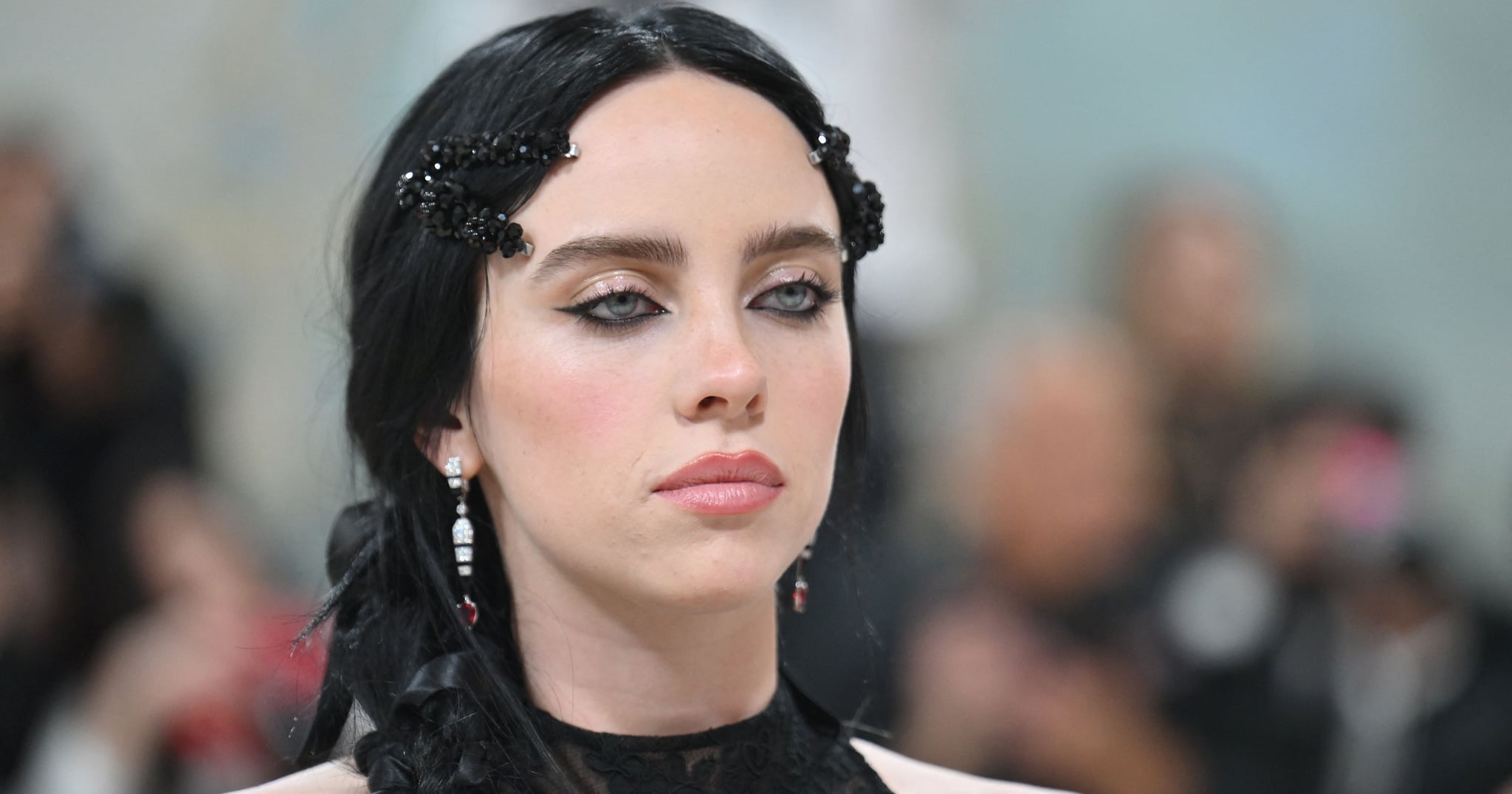 Billie Eilish's Cropped Tee and Low-Rise Jeans Put Her Hip Tattoo on Full Display