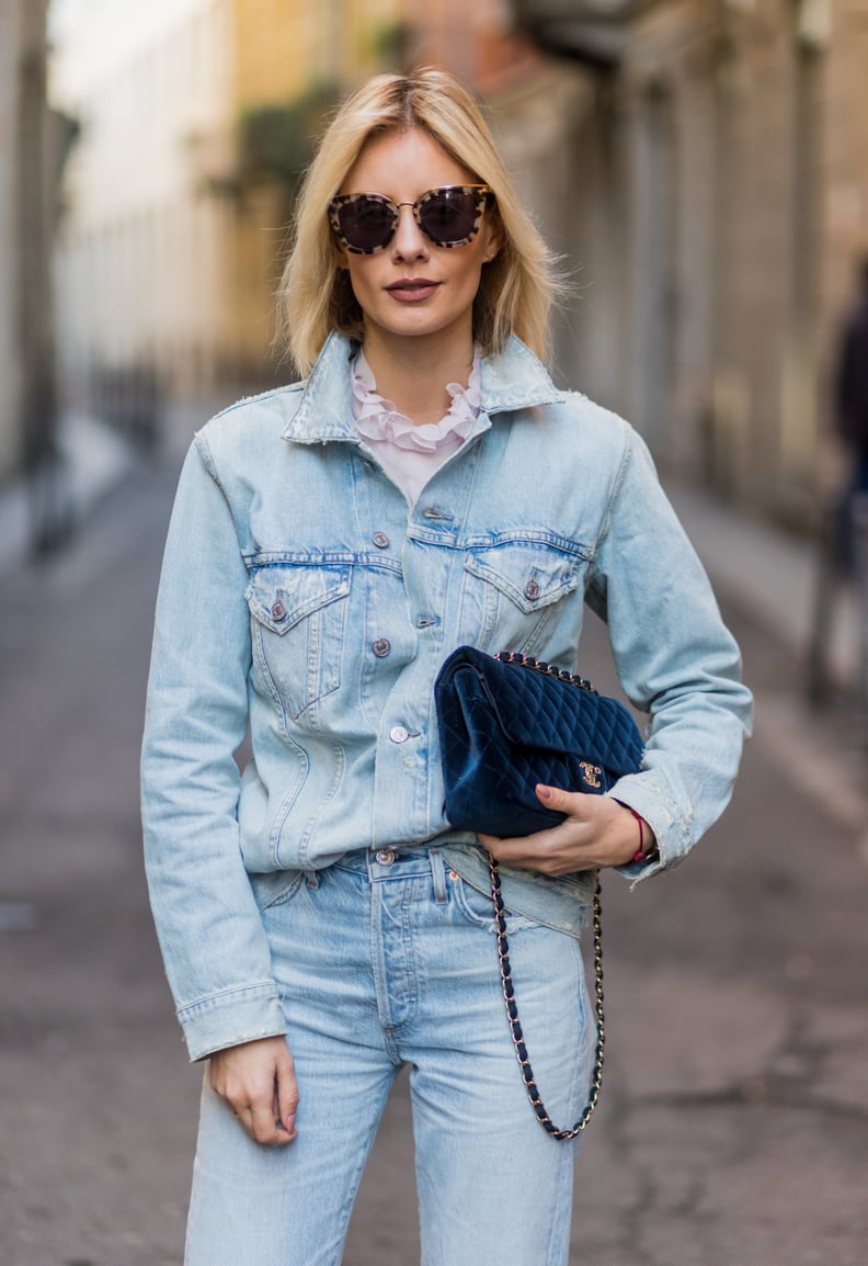 A Lightwash Chambray Top Tucked Into Jeans