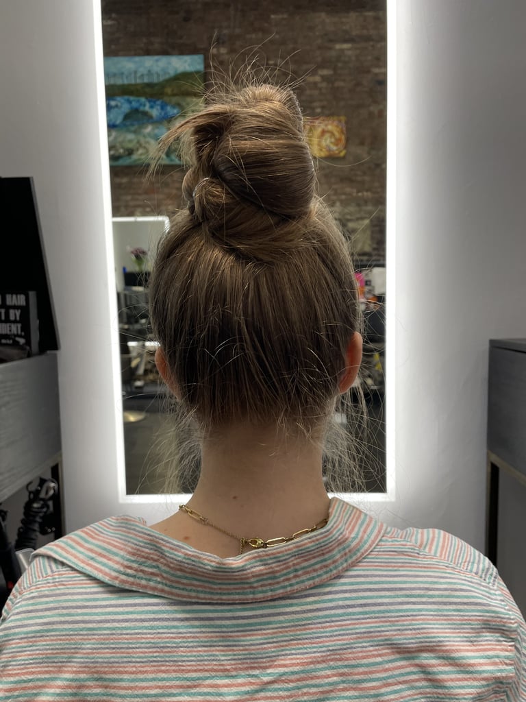 Hairstyles For Greasy Hair: Elevated Bun