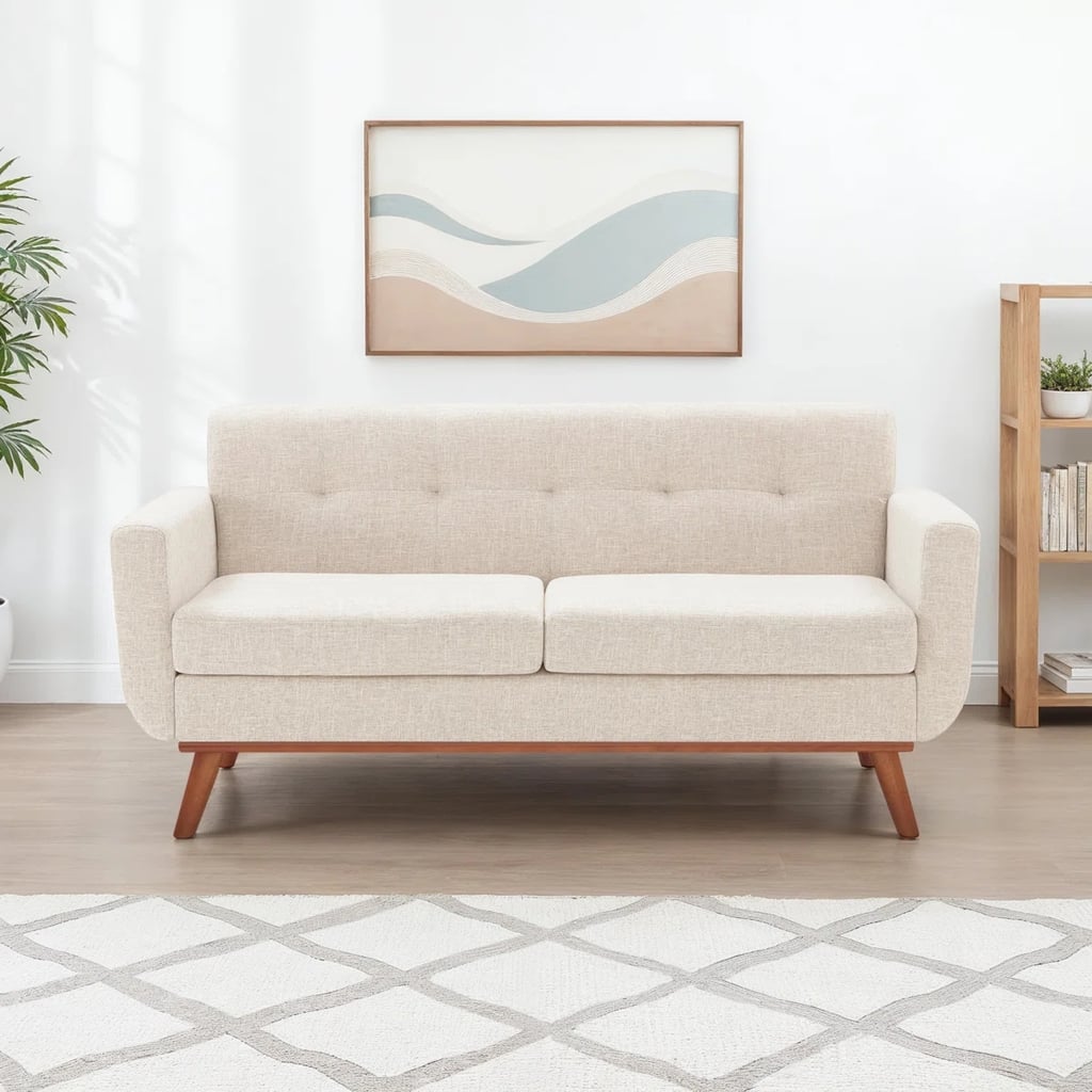 Wayfair Wade Logan Carmencita 65" Linen Upholstered Square Arm Loveseat  ($287, originally $470)
If you are shopping for big ticket items this Memorial Day, Wayfair should be your first stop. With discounts up to 70 percent off, it's hard not to at least scroll through the selection. Our top pick? This linen upholstered loveseat, which feels equal parts neutral and sophisticated.