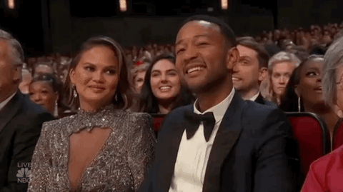 Chrissy Teigen literally HID from the camera!