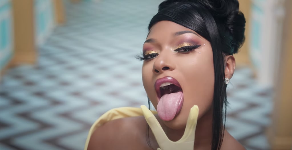 Megan Thee Stallion's Golden Eyeshadow, '90s-Inspired Lip Liner, and Yellow Manicure