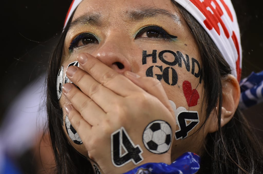 A Japanese fan cried during the game between Japan and Greece.