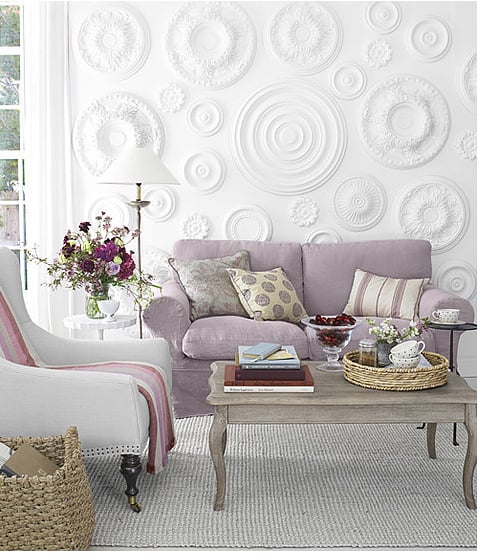 Country Living came up with the brilliant idea to use ceiling medallions as a wall treatment. 
Source: Country Living Magazine