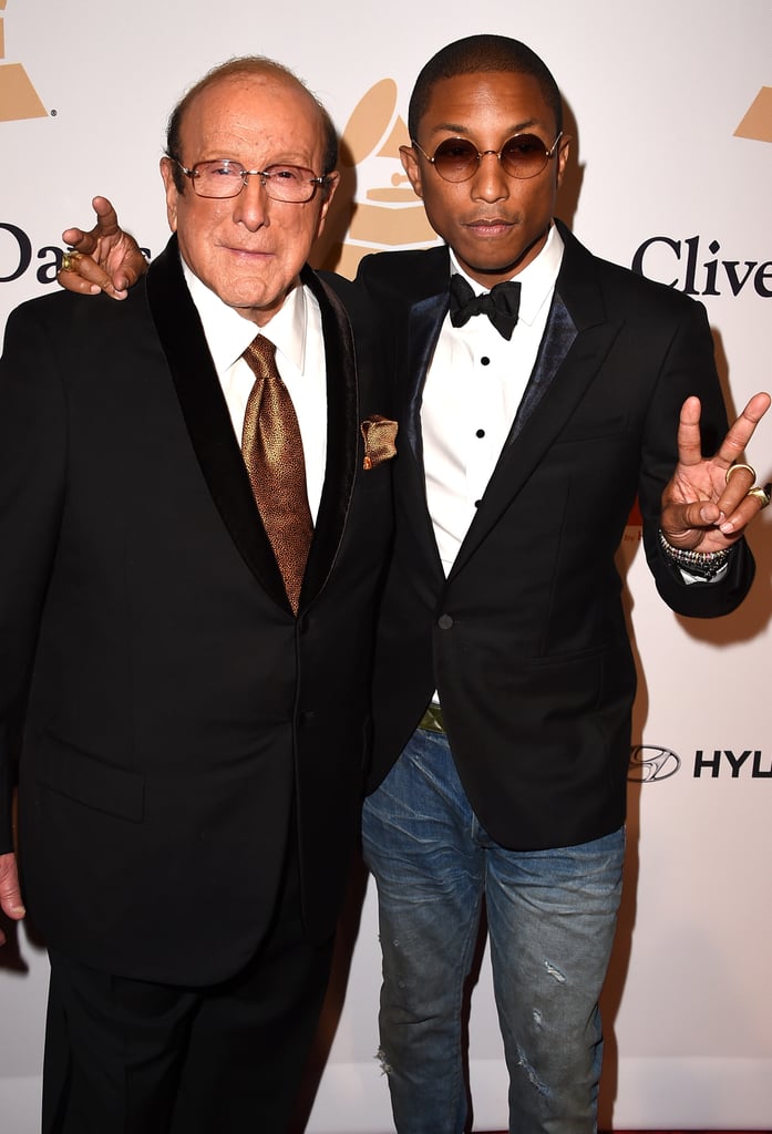 Clive Davis and Pharrell hit the red carpet at the executive's popular bash.