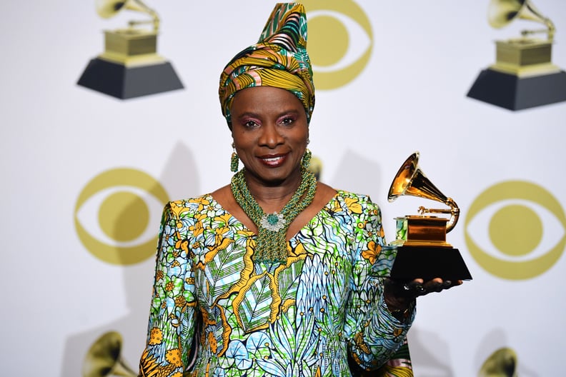 Beninese singer-songwriter Angelique Kidjo poses in the press room with the award for Best World Music Album for 