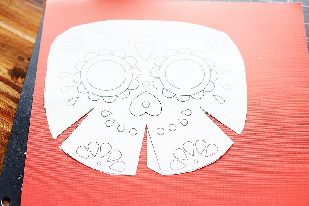 For the mask, you could go quite a few directions. We decided to use a paper mask and used this template from Happy Thought.