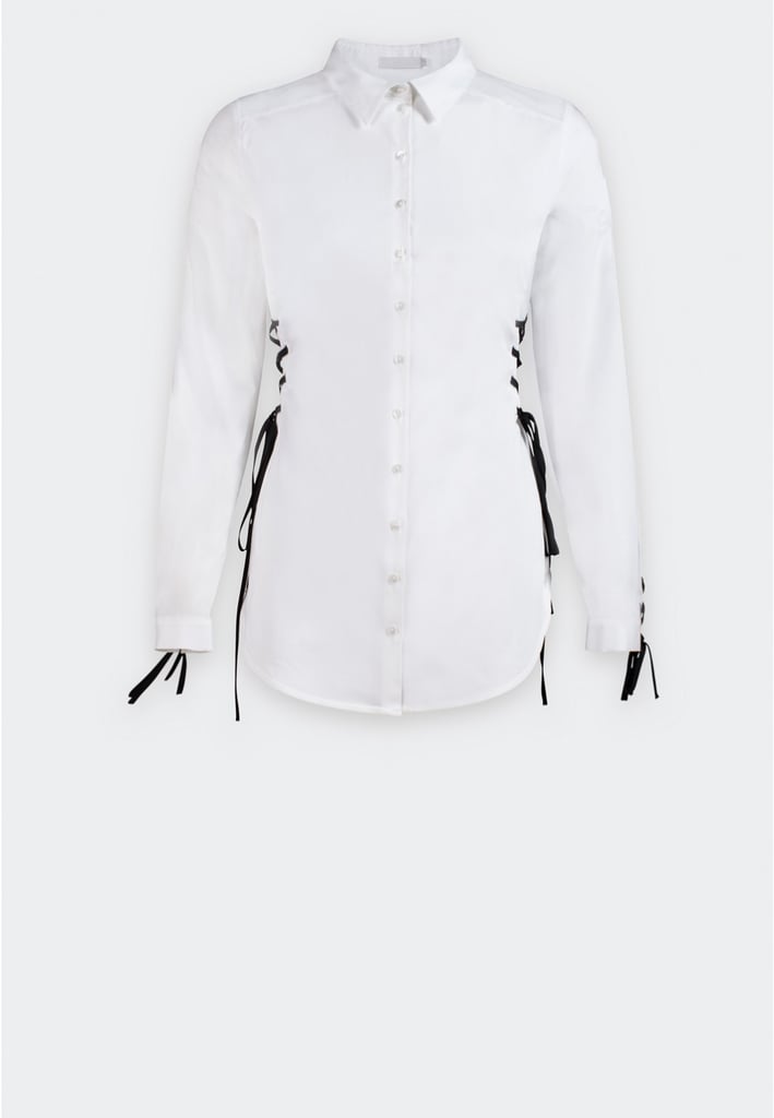 "Anne Fontaine is an on-the-rise Parisian designer who’s redefining the classic white button-down. Her Niagara top ($350) is next-level good, featuring black laced sides that you can swap out for white ties instead." — SW