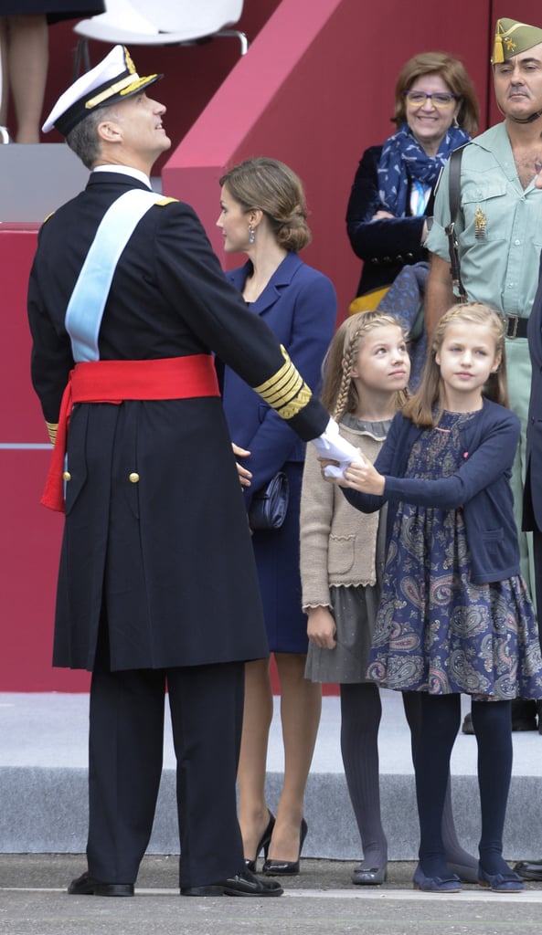 Princess Leonor holds on to King Felipe VI.