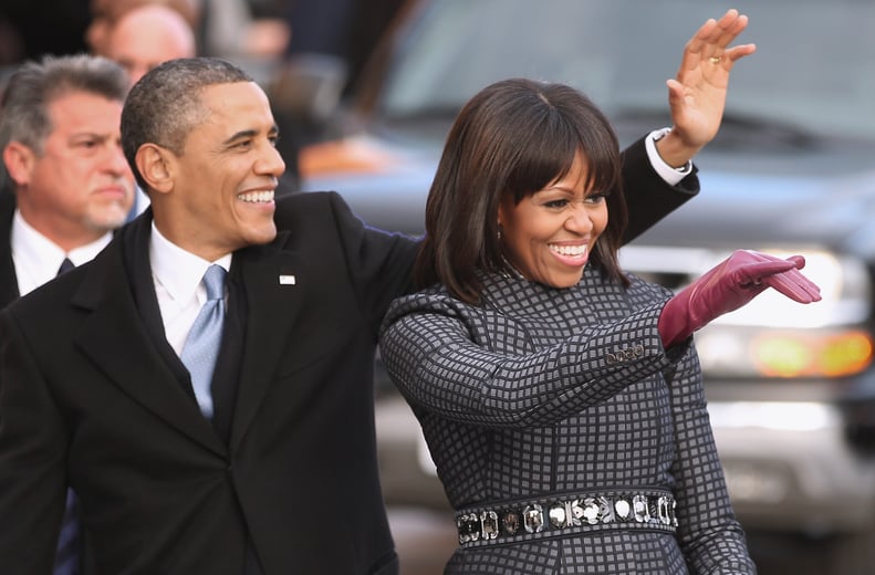WASHINGTON, DC - JANUARY 21:  U.S. President Barack Obama and first lady Michelle Obama wave to supporters as they walk the inaugural parade route down Pennsylvania Avenue January 21, 2013 in Washington, DC. President Obama took the oath of office earlier