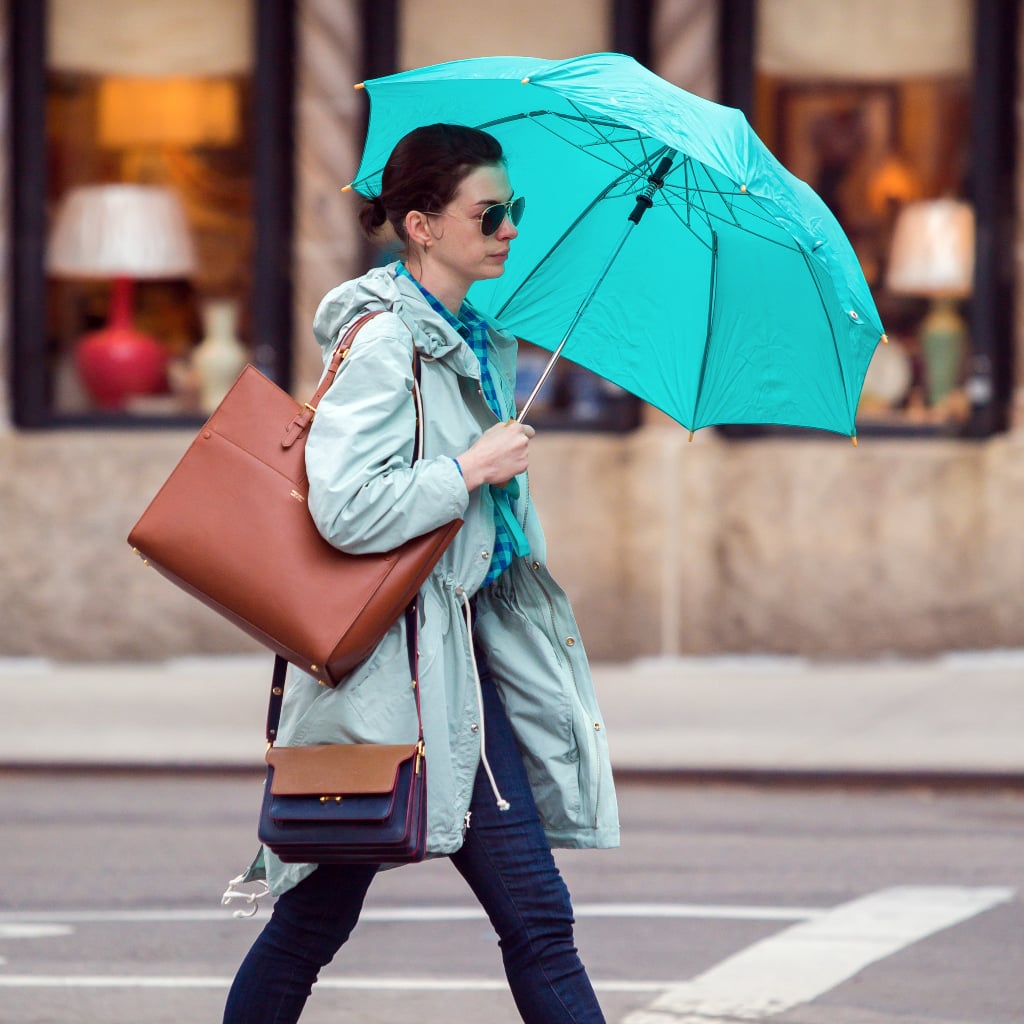 Anne Hathaway Carrying an Umbrella POPSUGAR Fashion