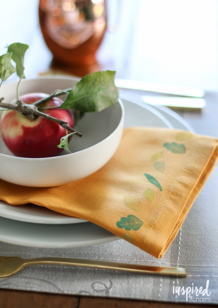 With basic fabric paint and some cute seasonal stamps, you can personalize your tablescape with DIY printed napkins.