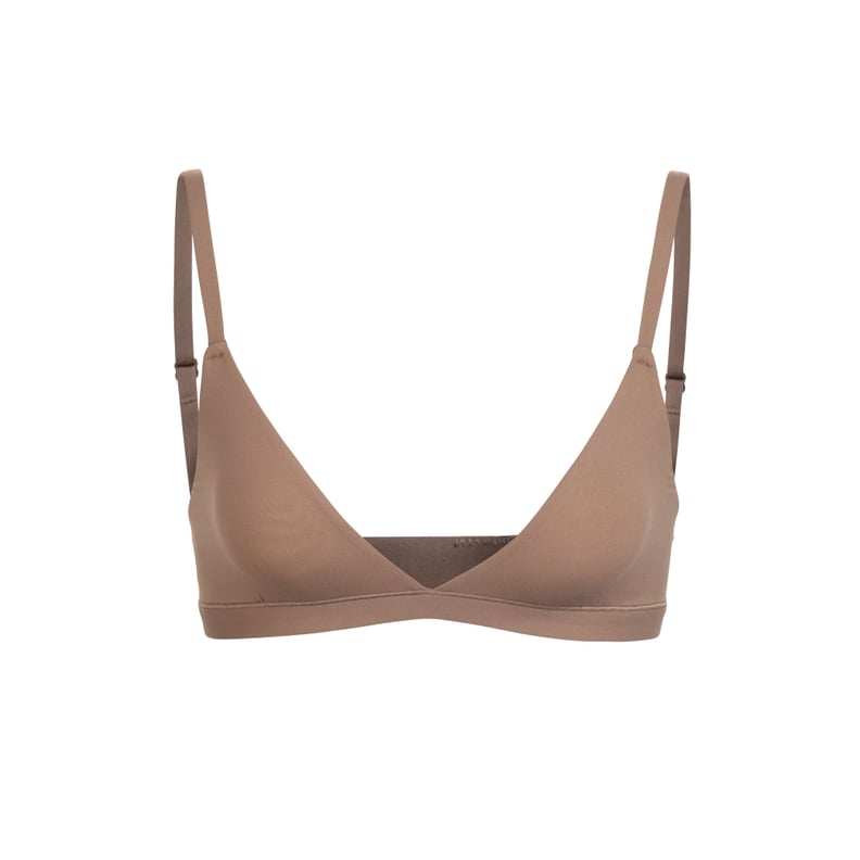 SKIMS - Kim Kardashian West wears the Scoop Neck Bra ($32) and the