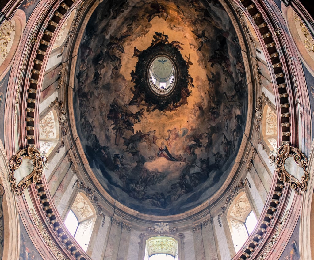 Although the outside detail is opulent enough to hypnotize anyone, be sure to head inside to take in the rich interior filled with golden stucco, as well as the astonishing turreted dome.