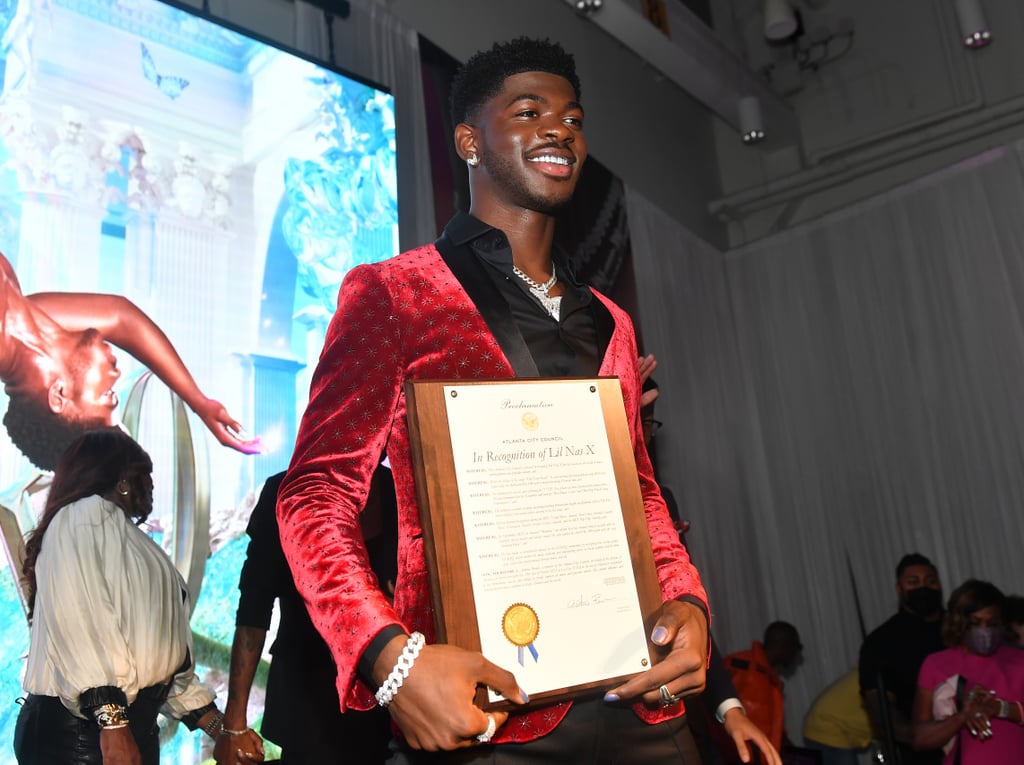 In what was just another day in the life, Lil Nas X was awarded with, well, his very own day. A little over a month after the release of the rap superstar's well-received debut album, Montero, the Atlanta City Council deemed Oct. 20 Lil Nas X Day in the city, which is close to the Lithia Springs, GA, community where he grew up. "His artistic influence and transformative music continue to shape Atlanta and the world," the proclamation read.
A celebration was thrown to mark the occasion, with stars including Chloe Bailey and Kandi Burruss in attendance. Presenting the certificate was Antonio Brown, who made history as the city's first openly gay city councilman when he was elected in 2019. Antonio read Lil Nas X the proclamation, which stated, "He has made a considerable impact on the LGBTQ community by reshaping how society accepts LGBTQ artists within the music industry and empowering others to break barriers and be more open, expressive, and personal through music and art."
See photos of the milestone moment in Lil Nas X's thriving career ahead.

    Related:

            
            
                                    
                            

            Lil Nas X&apos;s Purpose For Music Isn&apos;t Controversy, It&apos;s to "Help Others Find Themselves"