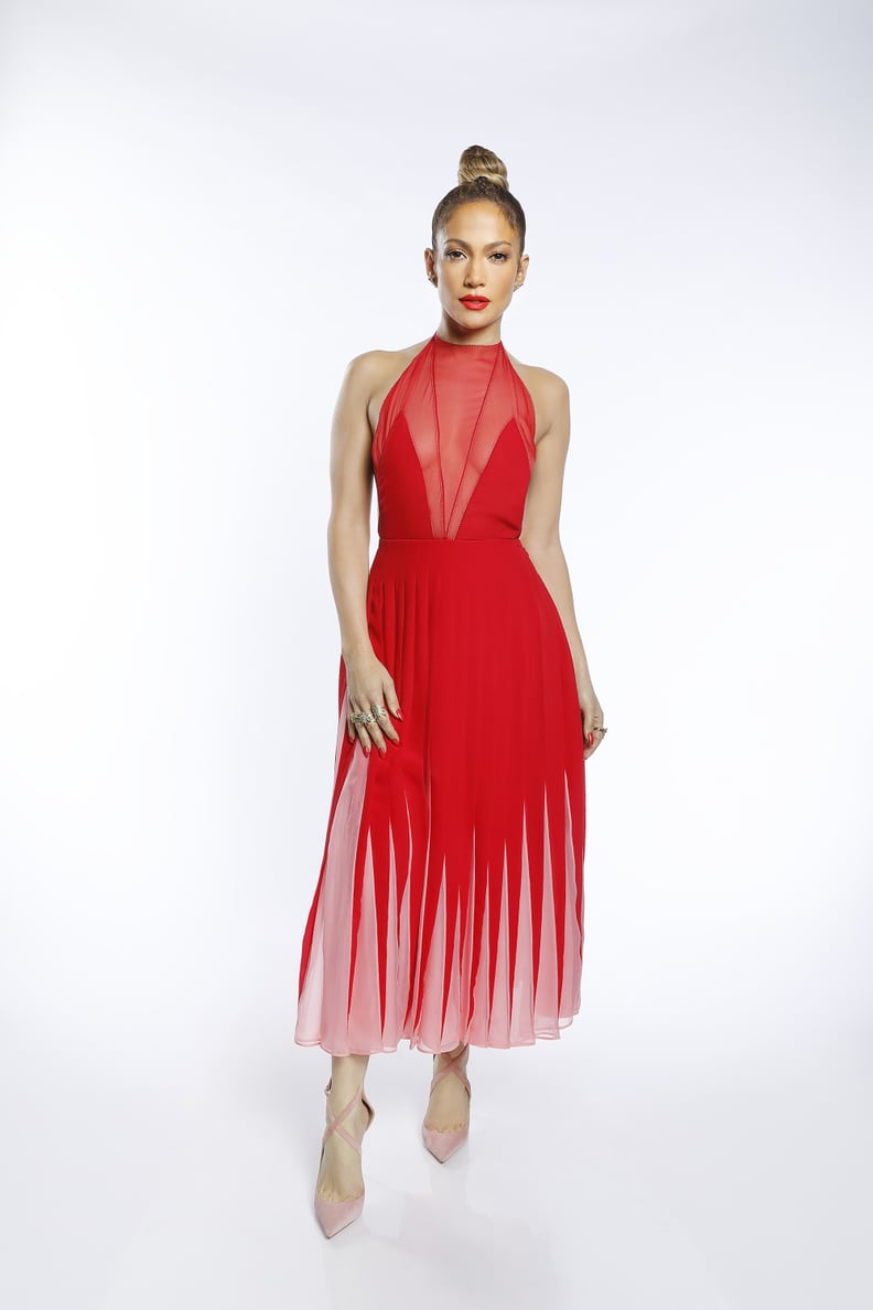 A Red Pleated Dress With Sheer Panels