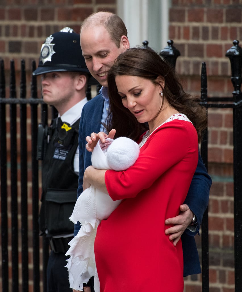 Will kept his hand around Kate's waist as she soothed baby Louis.