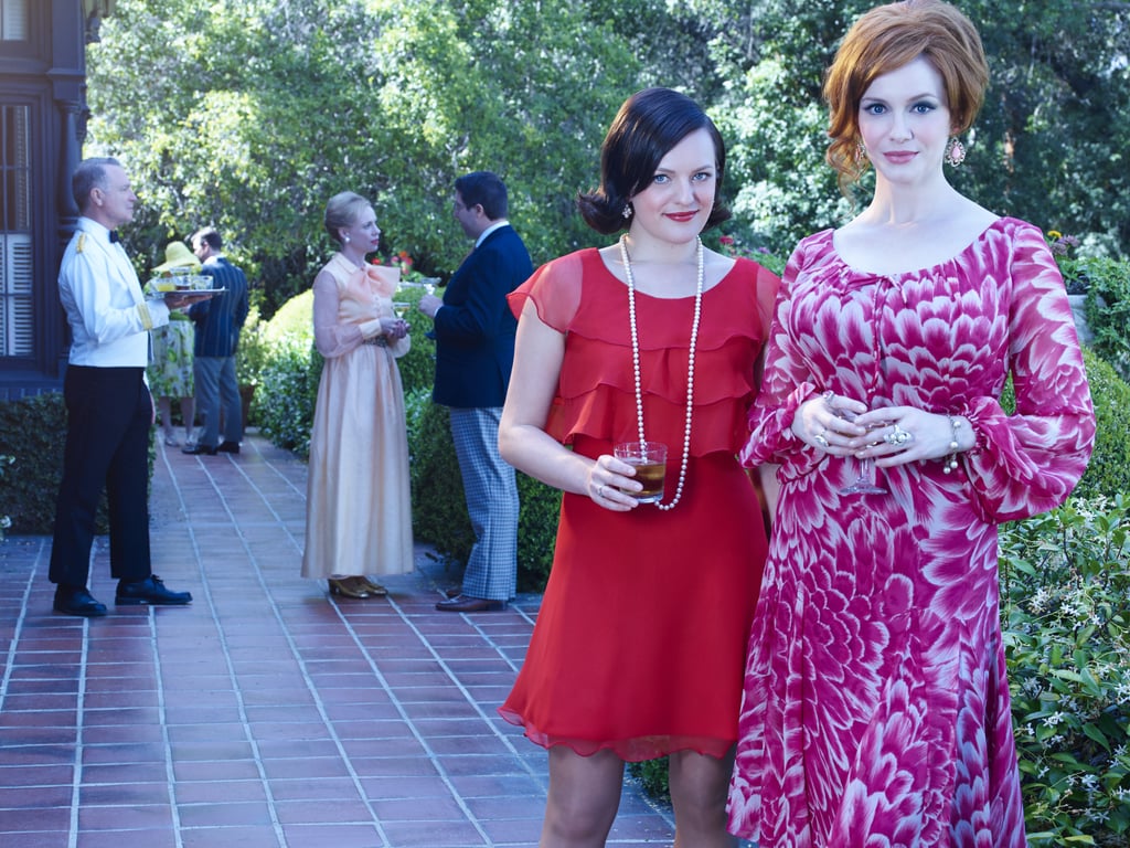 Peggy (Elisabeth Moss) and Joan (Christina Hendricks) pose together.