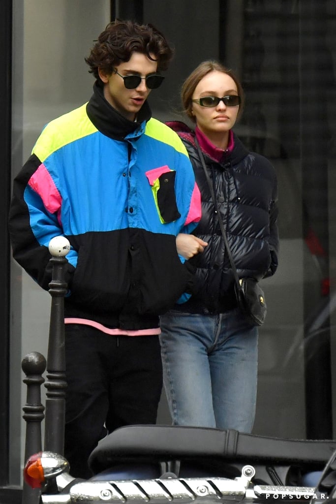 Walking the streets of Paris in a nostalgic colorblock windbreaker with Lily-Rose Depp.