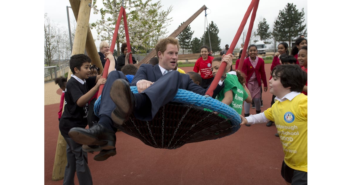Prince Harry played with children during a visit to the Queen