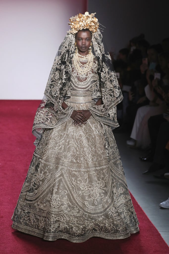 Right before his finale, Naeem Khan sent this gilded gold gown (complete with a matching headpiece) down the runway. A heartwarming recording about diversity played, ending with the phrase, "We are more alike than unalike."