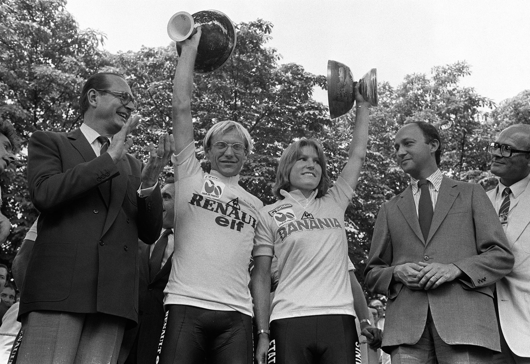 Tour de France winners Frenchman Laurent Fignon and Marianne Martin of the United States smile on the podium on July 22, 1984 in Paris, surrounded by Paris Mayor Jacques Chirac (L) and Prime Minister Laurent Fabius. Fignon reveals, on June 11, 2009 in Paris during the recording of a TV show released on June 14, that he suffers from and advanced stage cancer, but that there are no links with doping products. Fignon won the Tour de France in 1983 and 1984. AFP PHOTO FILES / AFP PHOTO / FILES        (Photo credit should read /AFP via Getty Images)