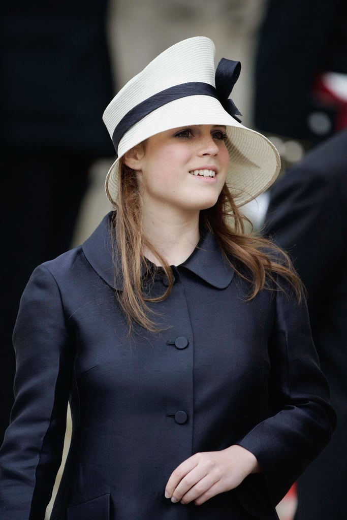 For the service which followed Prince Charles and Camilla's wedding, Eugenie wore a cream coloured hat with a navy ribbon.