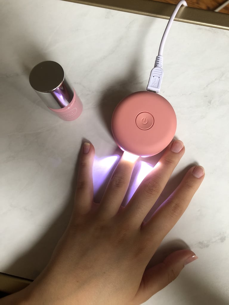 For a DIY mani, you start by applying an ultrathin coating of polish and curing it in the LED lamp for 30 seconds; you know your time is up when the lamp auto shuts off. After you repeat that on each finger, you can assess how many coats you want to do. Personally, I like doing two or three if the colour is super light. You may think curing one finger at a time would take a while, but the 30 seconds go by fast, and you can start painting the next finger while the one before it dries. My favourite part: the polish is quick drying, so there's no waiting around and fanning your hands frantically to keep from smudging. 
The gel manicure lasts the standard one to one-and-a-half weeks, depending on how rough you are on your hands, and is practically chip proof. What more could you need?