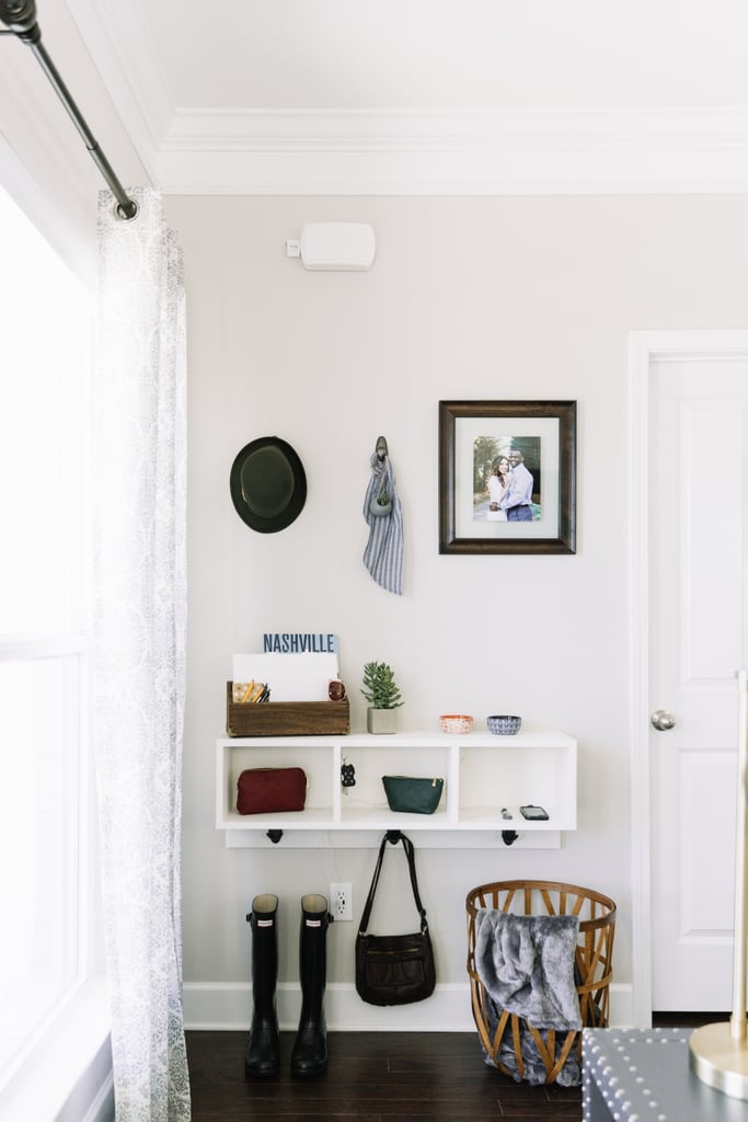 To avoid a pileup of coats, shoes, and mail in the middle of the living room, Monica DIYed a "drop zone" to collect all the entryway clutter.