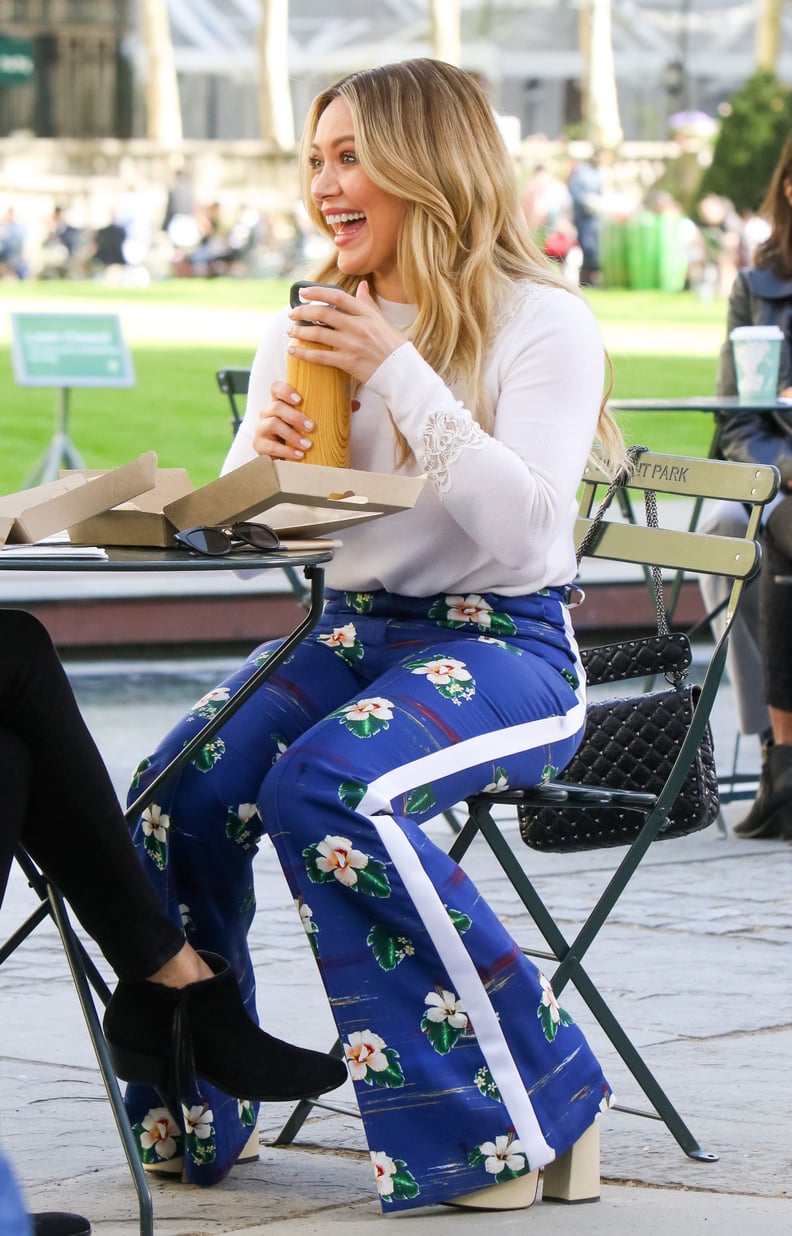 Who made Hillary Duff's sneakers, sweatshirt, and yellow print