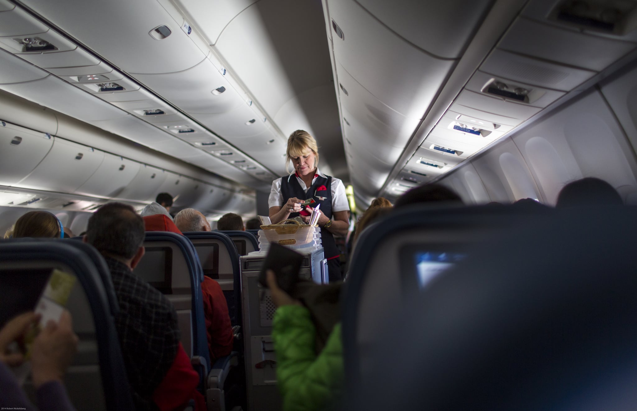 NEW YORK, NY - APRIL 11:  A Delta Airlines stewardess sells food on board a San Francisco, California bound plane April 11, 2014 outside of New York City. (Photo by Robert Nickelsberg/Getty Images)