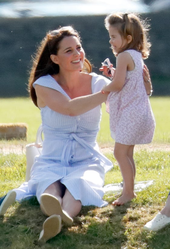 June: Kate cheered on William at a charity polo match.
