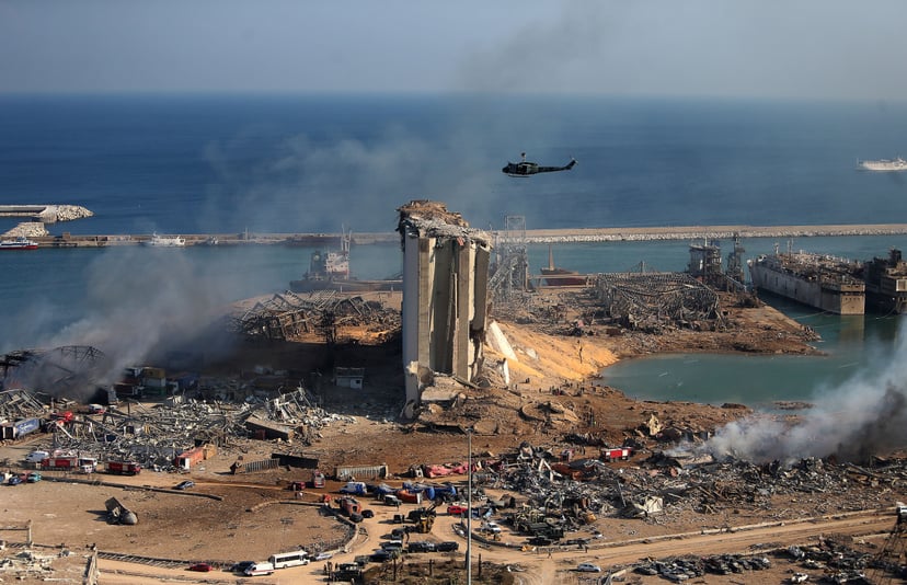 TOPSHOT - A general view shows the damaged grain silos of Beirut's harbour and its surroundings on August 5, 2020, one day after a powerful twin explosion tore through Lebanon's capital, resulting from the ignition of a huge depot of ammonium nitrate at t