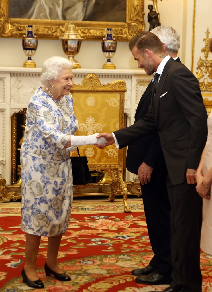 Six-foot-tall David Beckham still towers over the queen when he bows.
