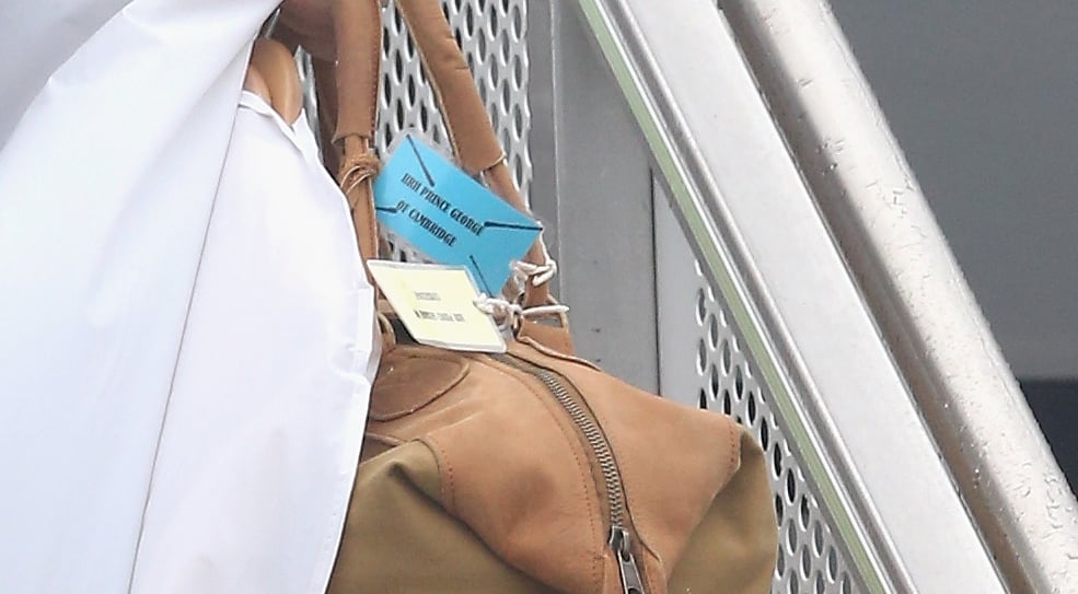 Even the luggage requires logistics.
A color-coded luggage-tag system (a color for each family member — George gets blue!) specifies where each piece goes. Prince William's luggage also typically has his monogram on it, while Kate's is an assortment. 
The royals have diplomatic passports. 
But fun fact — the queen is the only British citizen who doesn't require a passport.