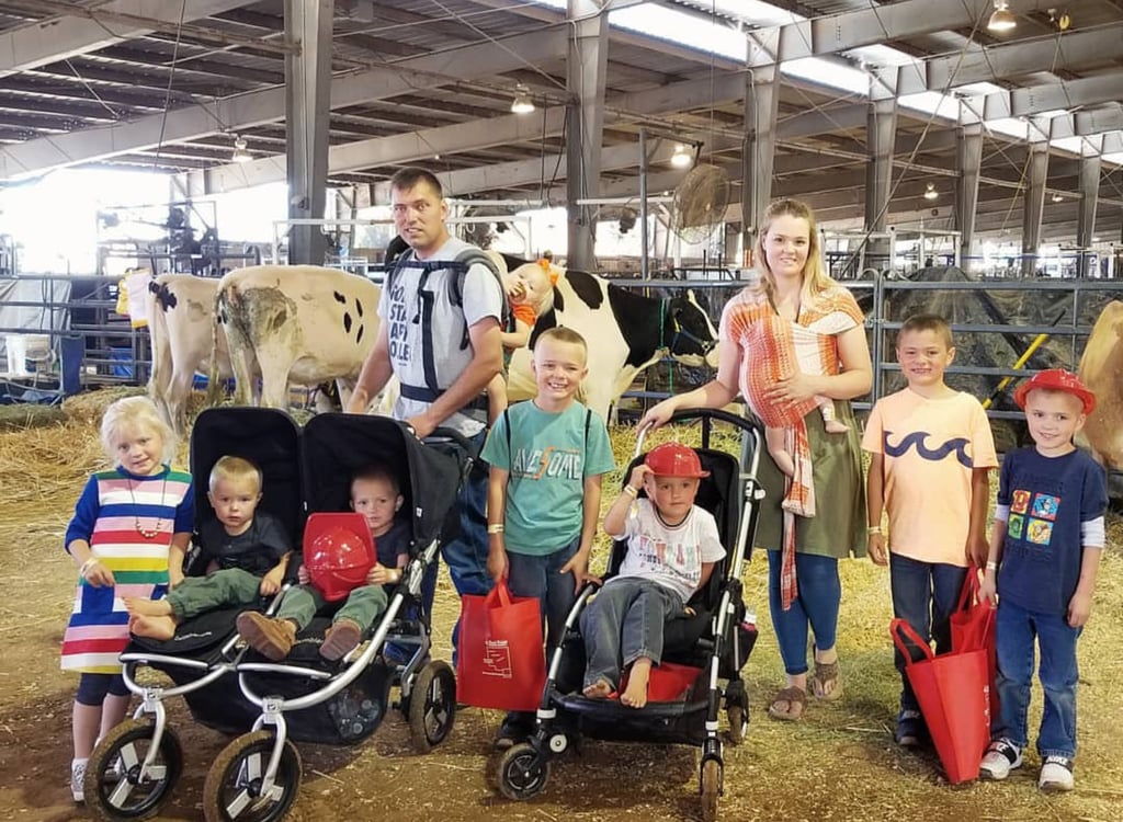 Despite some struggles, Courtney said that having multiple little ones has simply become part of her routine. "Having children super close in age is all I've ever known," she said. "Having multiple kids in diapers, babywearing, AND pushing a double stroller, taking a lifetime to get everyone out of the house is 'normal' for me." 
Having 10 kids running around might seem overwhelming to most parents, but Courtney has her family's schedule down pat. As to how they get from place to place? Using a 15-person van, of course! 
"I'm the type of mom who likes a daily schedule. Meals, naptime, and bedtime are predictable around here," she said. "We also currently home school. Book work gets done in shifts during the early morning and afternoons or after supper if we're running behind." 
She confessed that keeping the house clean can be a bit of a feat: "Housework is probably the main thing I struggle with," she said. "With so many littles there's always a mess. We ALL do our part to clean up (my husband included), and any 'extra' chores my children get paid to do. It works for us and my kids love the spending money for camp, fairs, or snacks in town."