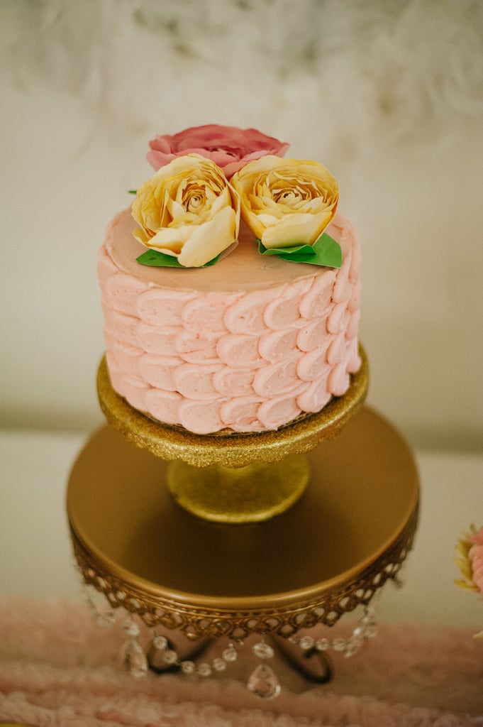 Paper flowers adorned the cake. SwanThemed Baby Shower POPSUGAR