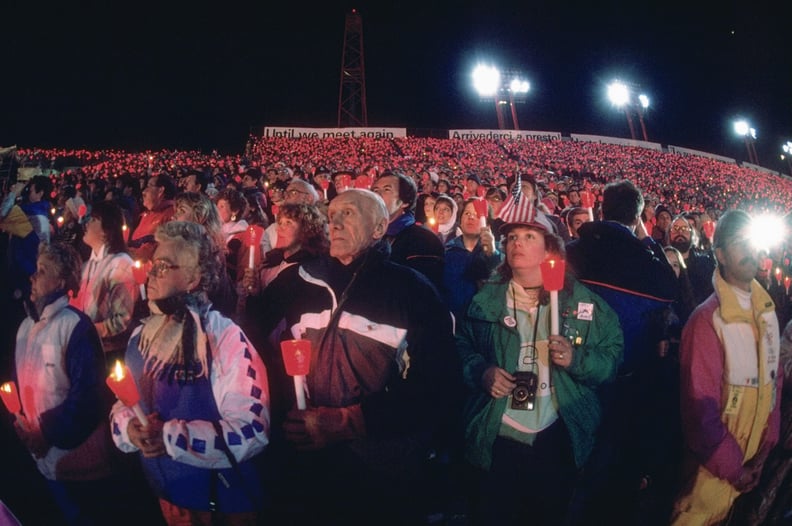 The stadium was filled with spectators holding up red candles.