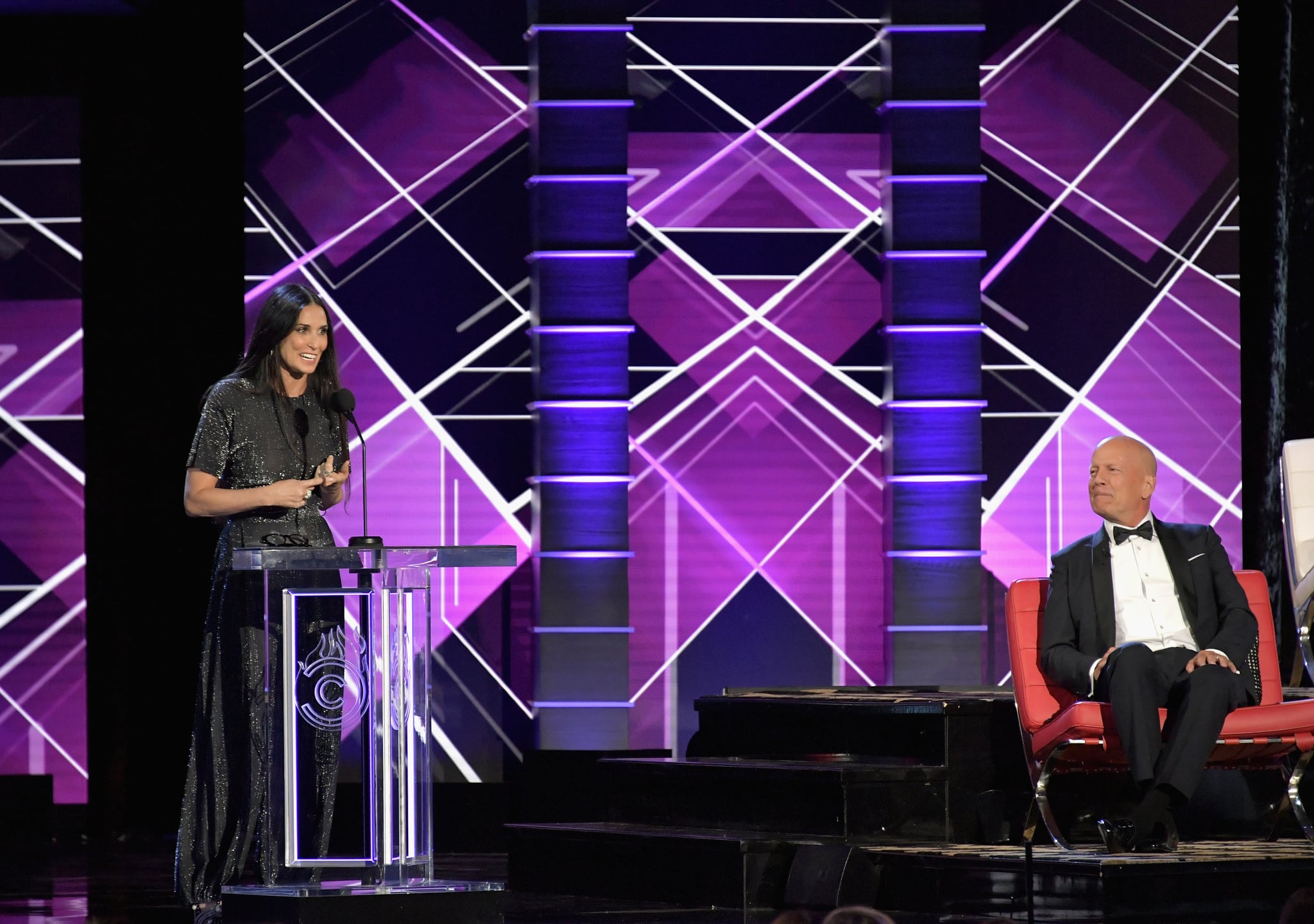 LOS ANGELES, CA - JULY 14:  Bruce Willis (R) reacts while Demi Moore speaks onstage during the Comedy Central Roast of Bruce Willis at Hollywood Palladium on July 14, 2018 in Los Angeles, California.  (Photo by Neilson Barnard/VMN18/Getty Images For Comedy Central)