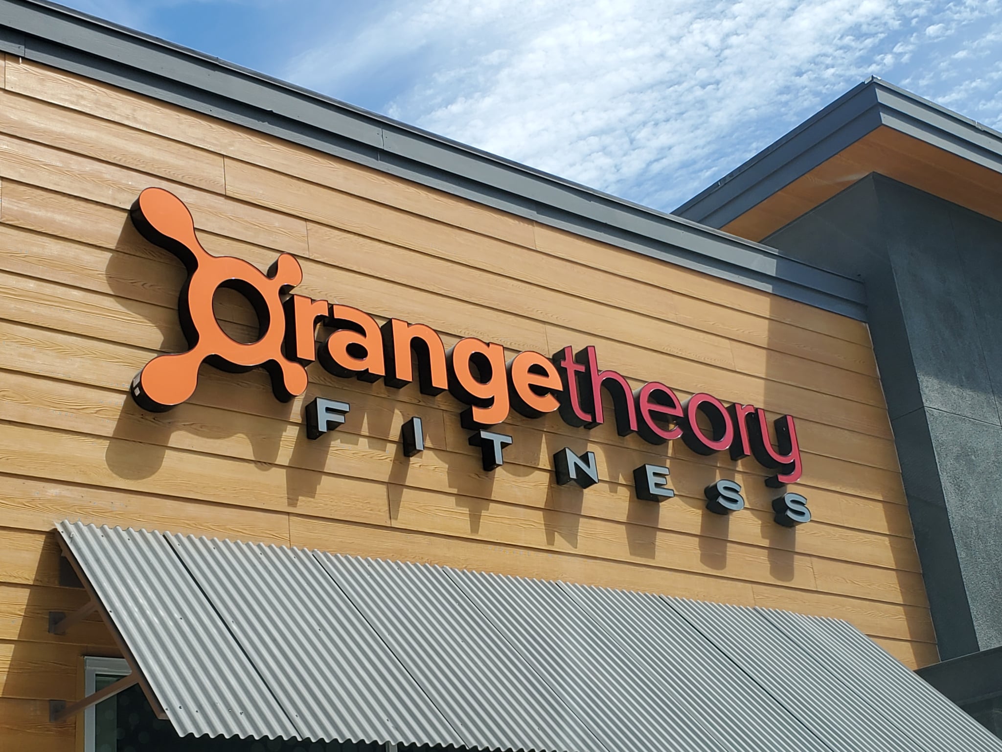 Sign with logo on facade of Orangetheory Fitness gym in Dublin, California, July 30, 2019. (Photo by Smith Collection/Gado/Getty Images)